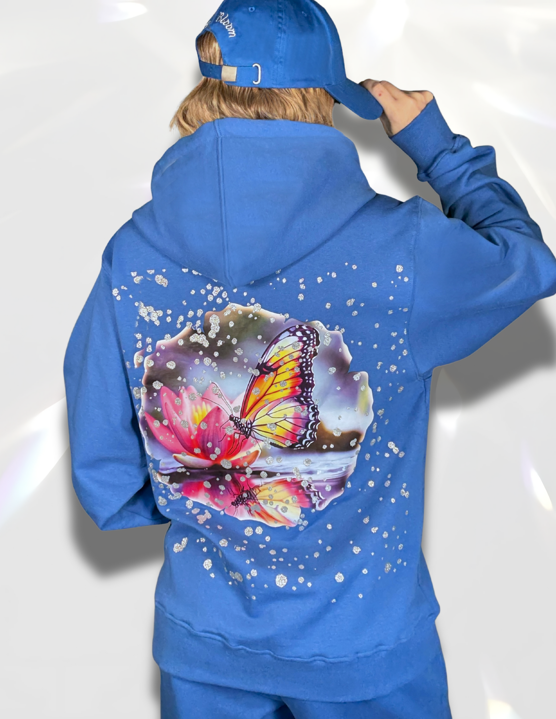 Gentle Silver Hoodie matching set with sweat pants and hat – Back of blue hoodie showing silver print and butterfly DTF print by Spicy Bloom.