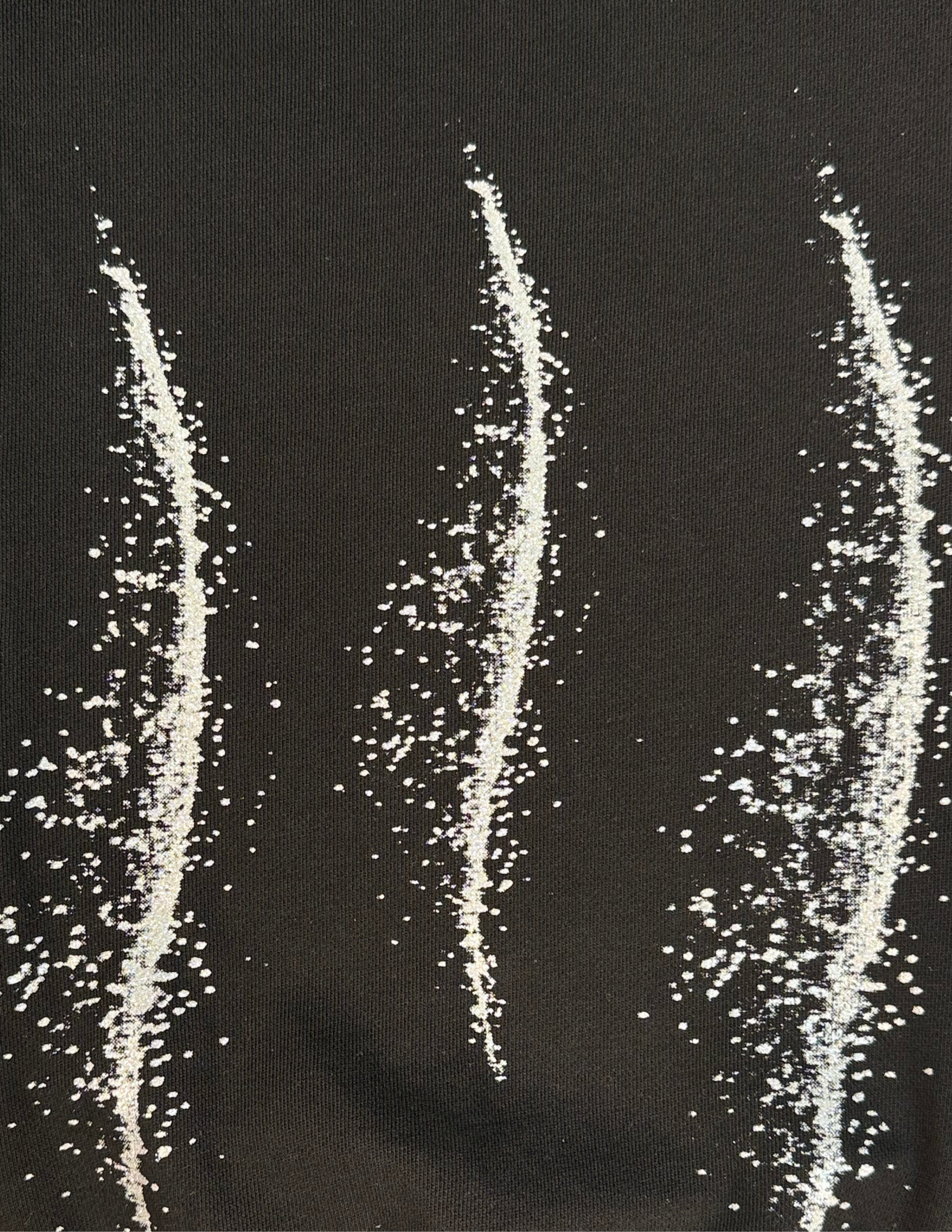 Silver glitter details on oversized black sweatpants