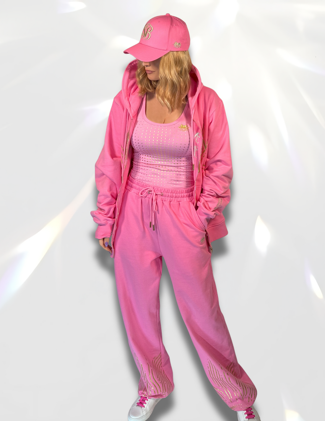Spicy Bloom silver sweatpants styled with matching hoodie and hat – soft luxury set.